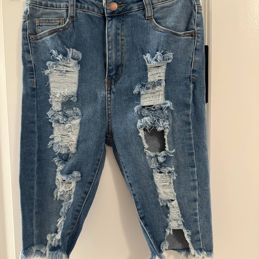 Distressed Blue Denim Jeans